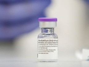 A vial of the Pfizer vaccine against the coronavirus disease (COVID-19) is seen as medical staff are vaccinated at Sheba Medical Center in Ramat Gan, Israel Dec. 19, 2020.
