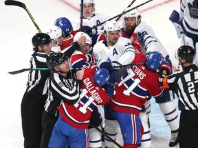 Toronto Maple and Montreal Canadiens players exchange blows during the second period in game six of the first round of the 2021 Stanley Cup Playoffs at Bell Centre.