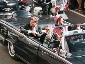 President John F. Kennedy’s motorcade in Dallas before his assassination on November 22, 1963.