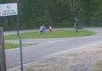 A knife-wielding man runs towards a girl Tuesday morning in Pensacola, Fla.