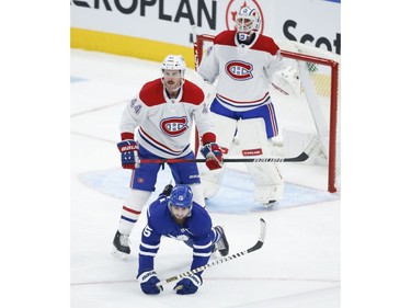 Montreal Canadiens Joel Edmundson D (44) crosschecks Toronto Maple Leafs Alexander Kerfoot C (15) for a two minute penalty during second period action in Toronto on Thursday May 6, 2021. Jack Boland/Toronto Sun/Postmedia Network