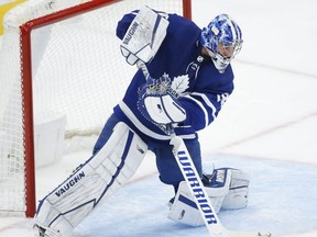 Toronto Maple Leafs Jack Campbell makes a save and fires the puck up the ice during second period action in Toronto on May 6, 2021.