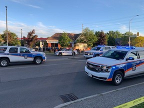 Police attend the scene of a shooting at Glen Erin Dr. and The Collegeway on Saturday, May 29 2021