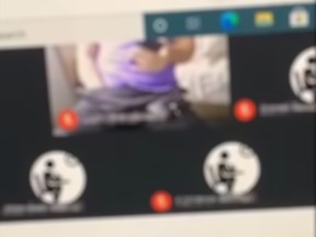A screengrab from a clip of a virtual classroom session at St. Stephen Catholic Secondary School in Bowmanville shows a man with his hand down his pants.