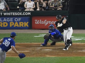 Chicago White Sox first baseman Andrew Vaughn  hits a home run against the Toronto Blue Jays on Tuesday night.