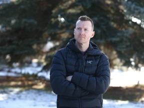 Olympic gymnastics medallist Kyle Shewfelt poses outside his southwest Calgary home.