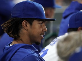 Adalberto Mondesi  of the Kansas City Royals watches from the dugout during their game against the Pittsburgh Pirates at Kauffman Stadium on June 01, 2021 in Kansas City, Missouri.