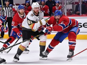 Jonathan Marchessault of the Vegas Golden Knights is defended by Shea Weber of the Montreal Canadiens during the third period in Game Four of the Stanley Cup Semifinals of the 2021 Stanley Cup Playoffs at Bell Centre on June 20, 2021 in Montreal, Quebec.