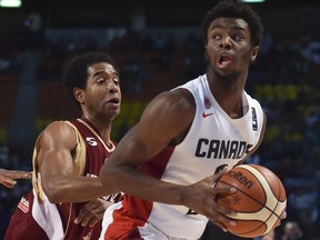 Venezuela's point guard Gregory Vargas (L) and teammate John Cox (C) mark Canada's shooting guard Andrew Wiggins (R) during their 2015 FIBA Americas Championship Men's Olympic Semi-final match at the Sport Palace in Mexico City on September 11, 2015.