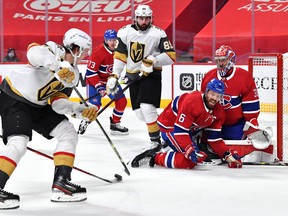 Defenceman Shea Weber and goalkeeper Carey Price come together in the Canadiens goal crease as they attempt to block a shot from Vegas’ Matthias Janmark during the final game of their semifinal series at the Bell Centre.