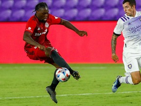 Toronto FC forward Ayo Akinola controls the ball against Orlando City in the second half at Orlando City Stadium on June 19, 2021.