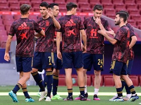Spain's players talk before the international friendly football match between Spain and Portugal at the Wanda Metropolitano stadium in Madrid in preperation for the UEFA European Championships, on June 4, 2021.