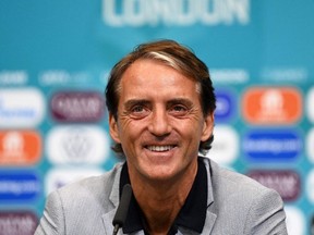 Italy's coach Roberto Mancini smiles during a press conference at Wembley Stadium on June 25, 2021, in London, on the eve of their UEFA Euro 2020 round-of-16 football match against Austria.