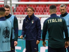 Italy's coach Roberto Mancini (C) leads a training session at the Allianz Arena in Munich on July 1, 2021, on the eve of their UEFA EURO 2020 quarter-final football match against Belgium. (Photo by Christof STACHE / AFP) (Photo by CHRISTOF STACHE/AFP via Getty Images)