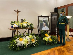 A military guard stands next to the urn of former Philippine President Benigno Aquino at the Heritage Park, in Taguig City, Metro Manila, Philippines, June 24, 2021.