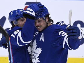Toronto Maple Leafs centre Auston Matthews (34) celebrates his goal with teammate MitchMarner (16) during NHL action in Toronto on Monday March 29, 2021.
