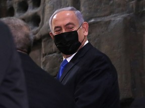 Israeli Prime Minister Benjamin Netenyahu arrives to the Knesset ahead of a parliamentary vote on a new government, in Jerusalem, on June 13, 2021.