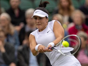 Canada's Bianca Andreescu returns against France's Alize Cornet during their women's singles first round match on the third day of the 2021 Wimbledon Championships at The All England Tennis Club in Wimbledon, southwest London, on June 30, 2021.