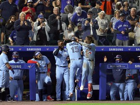 Toronto Blue Jays centre fielder Randal Grichuk (15) celebrates his solo home run with teammates at Sahlen Field.