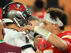 Tom Brady of the Tampa Bay Buccaneers and Patrick Mahomes of the Kansas City Chiefs speak after Super Bowl LV at Raymond James Stadium on February 7, 2021 in Tampa, Florida. 

 (Photo by Mike Ehrmann/Getty Images)