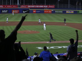 Yankees fans celebrate after a home run by Yankees' Brett Gardner the during the seventh inning against the Blue Jays at Sahlen Field in Buffalo on Tuesday, June 15, 2021.