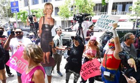 A life-size cardboard cutout of Britney Spears in seen as fans and supporters gather outside the County Courthouse in Los Angeles during a scheduled hearing in Spears’ conservatorship case, Wednesday, June 23, 2021.