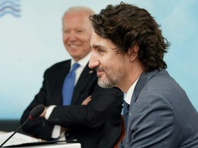 U.S. President Joe Biden and Prime Minister Justin Trudeau attend a session during the G7 summit in Carbis Bay, Cornwall, England, June 11, 2021.