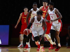 Luguentz Dort dribbles the ball as Team Canada assured its spot in the semifinal round with a convincing win over China at the Olympic qualifiers in Victoria, B.C. on Wednesday, June 30, 2021.