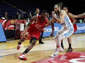 Andrew Wiggins makes a move against a Greek player during Olympic qualifying in Victoria, B.C. on Tuesday, June 29, 2021. Wiggins led the way for Canada with  led Canada with 23 points in the home side's victory.