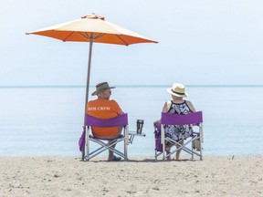 Randy and Tina McLeod of St. Thomas, Ont., enjoy a day at the beach in Port Stanley, Ont., Tuesday, June 1, 2021.