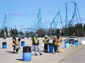 Health-care workers get ready to take patients at a drive-thru COVID-19 mass vaccination site at Canada's Wonderland during the COVID-19 pandemic in Vaughan March 29, 2021.
