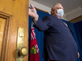 Ontario Premier Doug Ford arrives to make an announcement during the daily briefing at Queen's Park in Toronto on Thursday April 1, 2021.