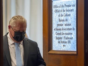 Ontario Premier Doug Ford leaves his office for a press conference at the Ontario Legislature in Toronto, Thursday, May 13, 2021.