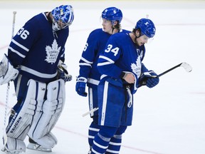 Auston Matthews (34) and teammates Mitchell Marner (16) and Jack Campbell (36) skate off in dejection at the end of third period NHL Stanley Cup hockey action against the Montreal Canadiens, in Toronto, Monday, May 31, 2021