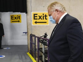 Ontario Premier Doug Ford leaves after touring a COVID vaccine site in Brampton, Ont., on Thursday, June 3, 2021.