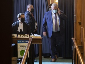 Premier Doug Ford leaves a voting area at the Queens Park Legislature in Toronto, on Monday June 14, 2021.