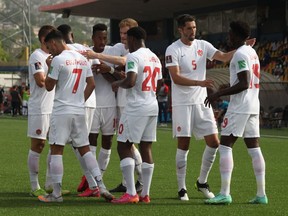 Members of the Canadian soccer team celebrate Cyle Larin's goal against Haiti in Port-au-Prince on June 12, 2022. Canada went on to win the team game series with Haiti and moved on to the main eight-team CONCACAF Qualifying group.