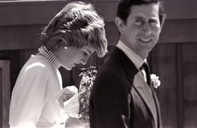 Princess Diana bows her head following Prince Charles on a walk to the California Pavilion in Vancouver May 6, 1986.