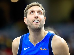 Dirk Nowitzki of the Dallas Mavericks watches the action against the  Indiana Pacers at Bankers Life Fieldhouse on January 19, 2019 in Indianapolis.