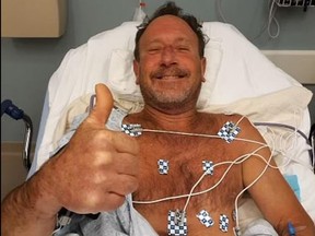 Michael Packard gives the thumbs up from his hospital bed after being swallowed whole by a humpback whale.