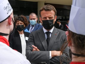 French President Emmanuel Macron talks with hospitality school students in Tain l'Hermitage, Drome department, France, Tuesday, June 8, 2021.
