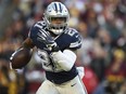 Ezekiel Elliott of the Dallas Cowboys carries the ball against Washington at FedExField on October 21, 2018 in Landover, Maryland.