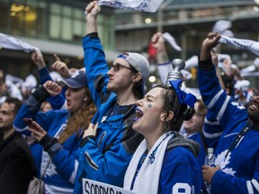 Leafs fans view Game 7 action between the Maple Leafs and Boston Bruins in the first round of NHL the playoffs on the big screens outside of Scotiabank Arena on Bremner Blvd in Toronto on Tuesday, April 23, 2019.