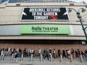 Fans stand in line to get into the Foo Fighters show as Madison Square Garden reopens with the first full capacity concert since March 2020, on Sunday, June 20, 2021 in New York City.