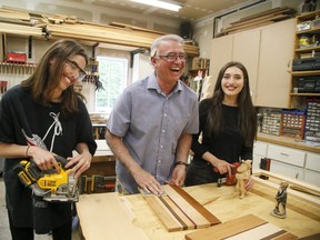 Joeseph Fabrizio of Stouffville Ontario teaches his daughters about woodworking in his shop