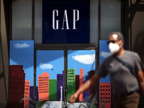 A pedestrian walks by the closed Gap flagship store on August 18, 2020 in San Francisco, Calif.
