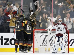 Philipp Grubauer of the Colorado Avalanche stands in his crease as the Vegas Golden Knights celebrate a third-period goal by Max Pacioretty at T-Mobile Arena on June 4, 2021 in Las Vegas.