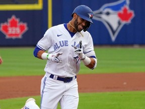 Blue Jays’ Lourdes Gurriel Jr. runs the bases after hitting a grand slam home run during the first inning against the Baltimore Orioles at Sahlen Field in Buffalo last night.  Getty Images