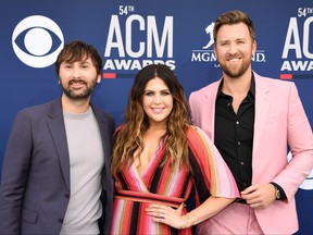 From left to right: Dave Haywood, Hillary Scott and Charles Kelley of country music group Lady A arrive for the 54th Academy of Country Music Awards on April 7, 2019, at the MGM Grand Garden Arena in Las Vegas, Nevada.