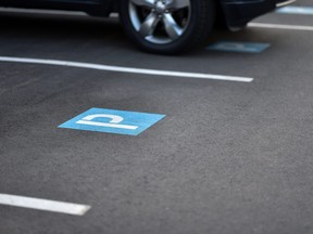 painted parking sign on the asphalt.